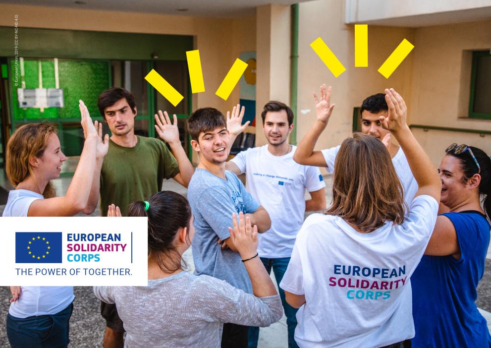 7 youngsters who are part of the eruopean solidarity corps are in a circle with their hands up while one of them is in the middle. The ESC logo is on the bottom left corner and the yellow visual elements are on the top of the image